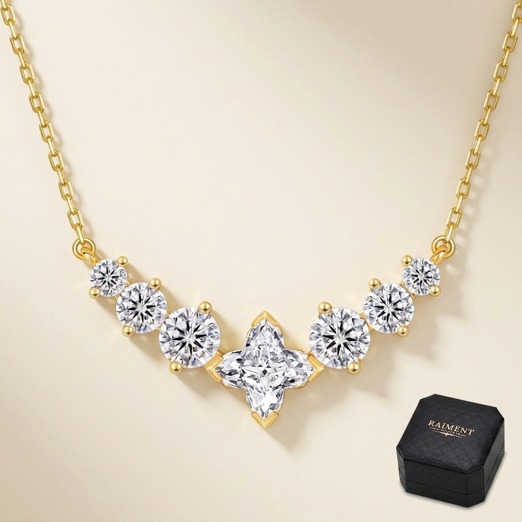 Moissanite chevron cluster necklace on cream background, Raiment Jewelry & Co.