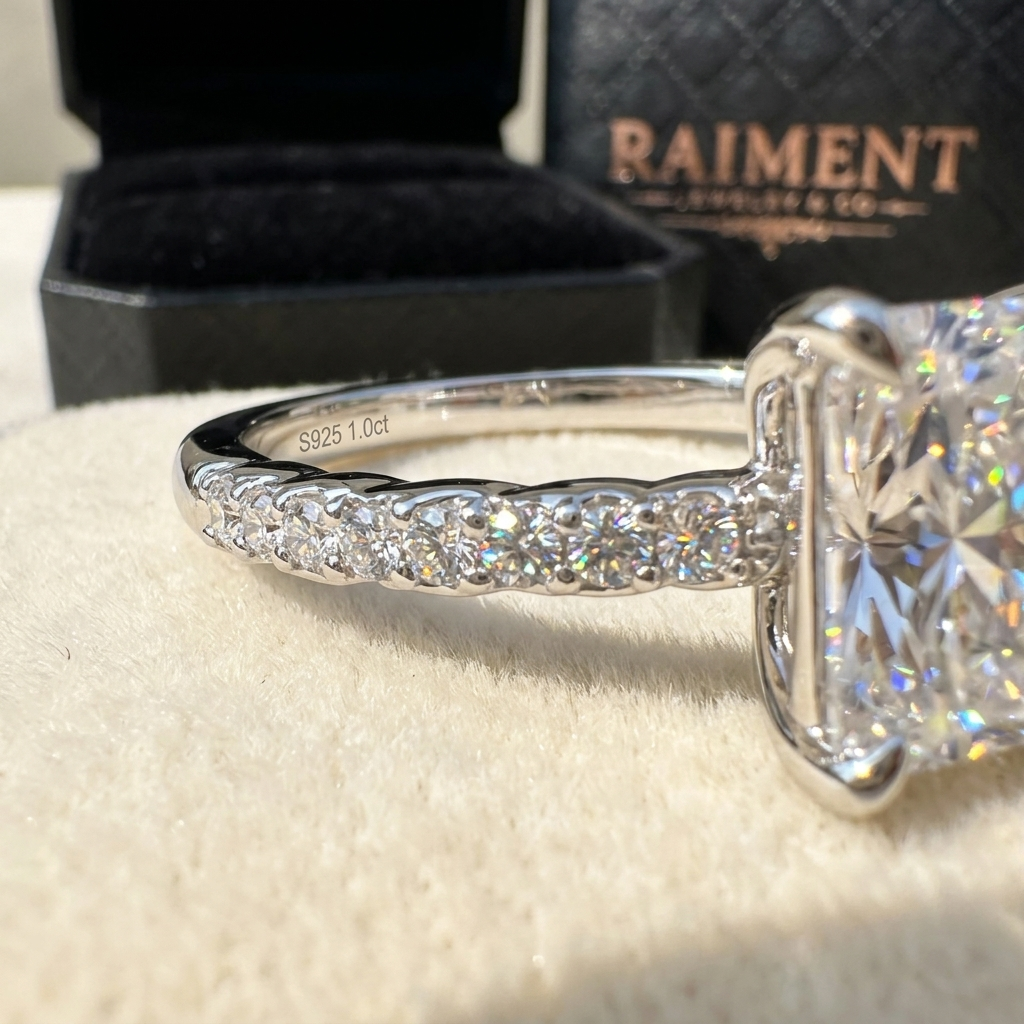 Moissanite twist accent band ring macro close-up, Raiment Jewelry & Co.