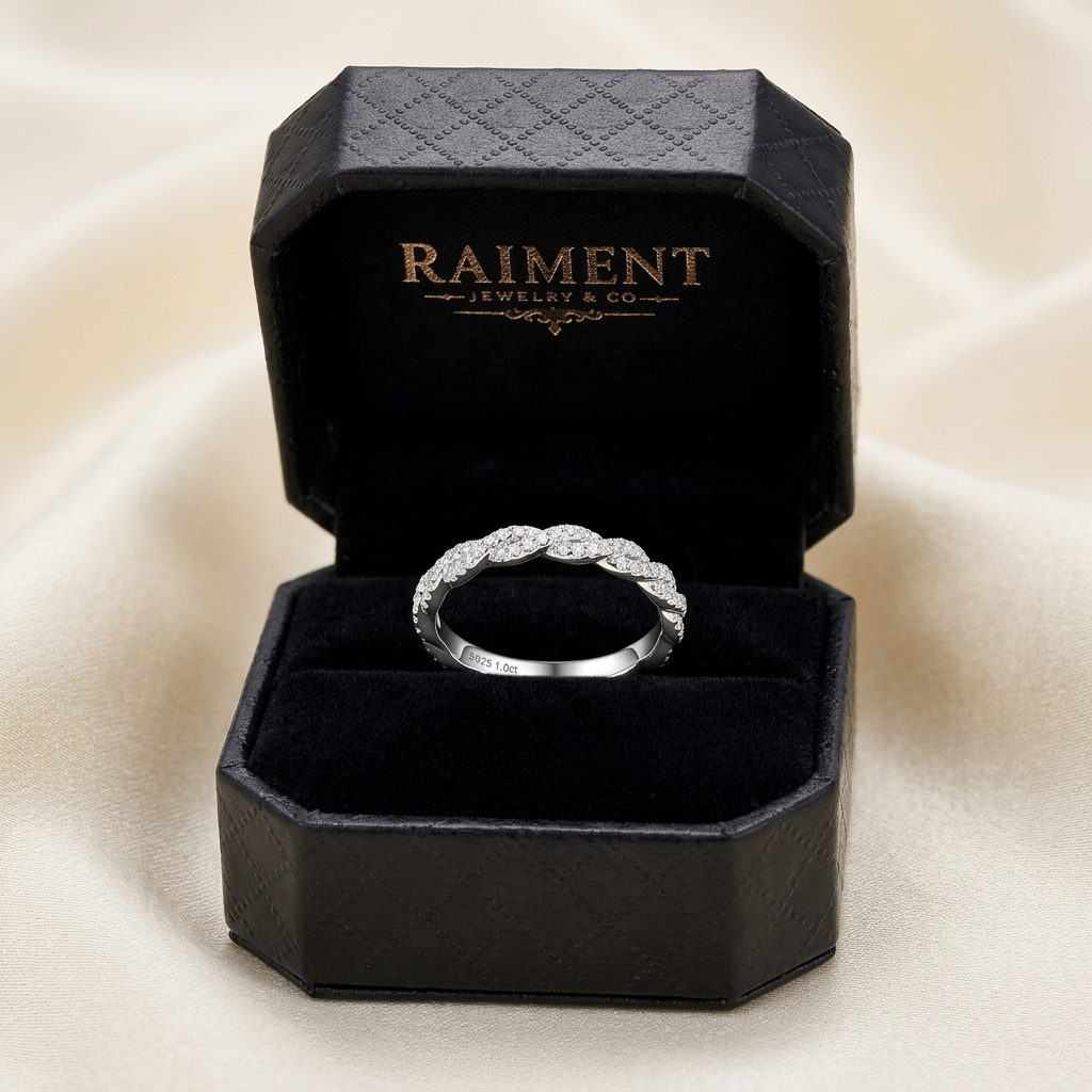Moissanite twist accent band ring inside open jewelry box, Raiment Jewelry & Co.
