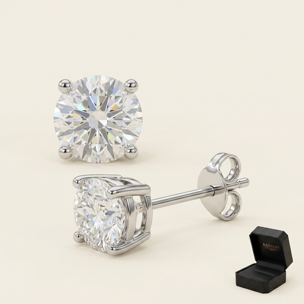 Moissanite 4-claw solitaire stud earrings on cream background, Raiment Jewelry & Co.