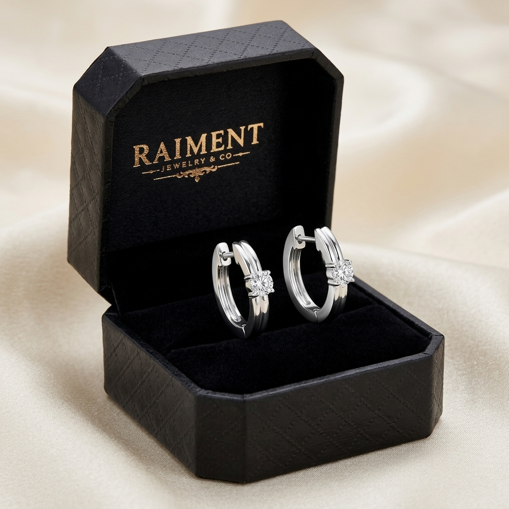 Moissanite huggie hoop earrings inside open jewelry box, Raiment Jewelry & Co.