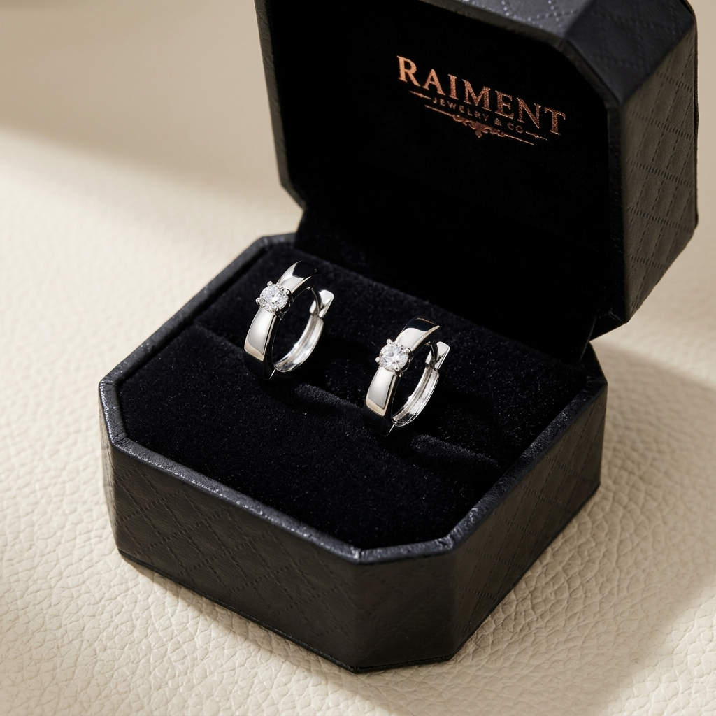 Moissanite slim huggie hoop earrings inside open jewelry box, Raiment Jewelry & Co.