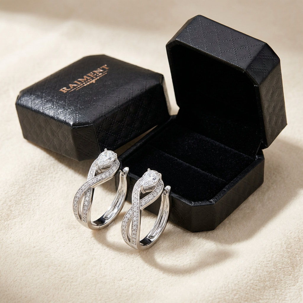Moissanite pave hoop earrings styled beside jewelry box on cream, Raiment Jewelry & Co.