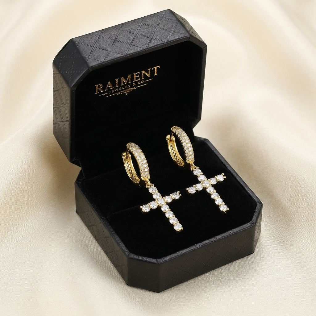 Moissanite cross huggie earrings inside open jewelry box, Raiment Jewelry & Co.