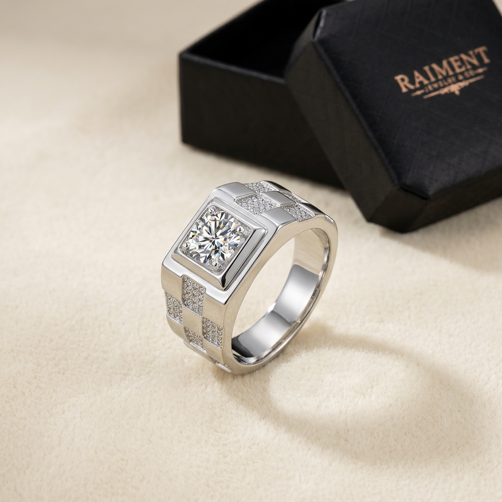 Men's moissanite step-shank ring on cream background, Raiment Jewelry & Co.