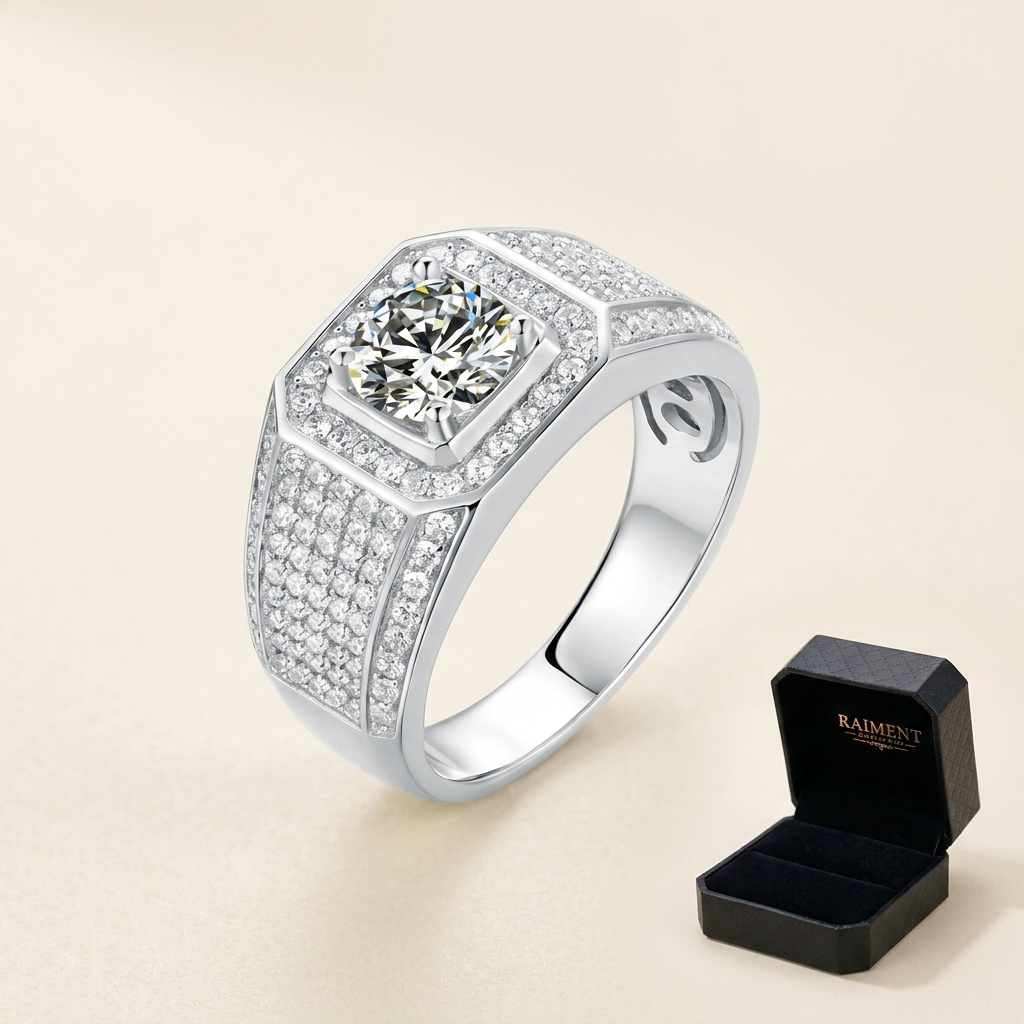 Moissanite three-stone accent ring on cream background, Raiment Jewelry & Co.