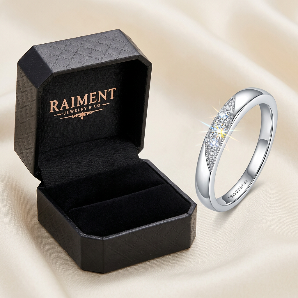 Raiment Jewelry & Co. moissanite trio cluster ring beside open jewelry box on cream background