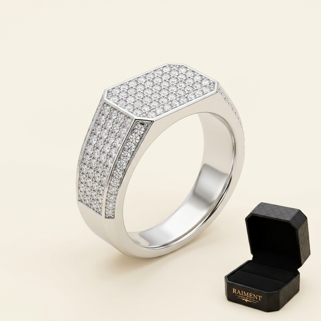 Men's iced-out moissanite ring on cream background, Raiment Jewelry & Co.