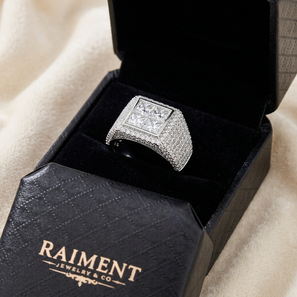 Men's iced-out quad moissanite ring inside open jewelry box, Raiment Jewelry & Co.