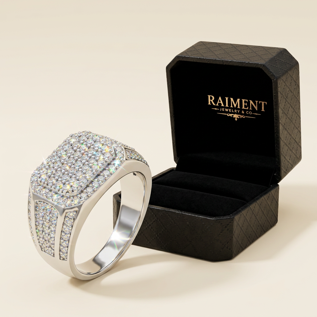 Raiment Jewelry & Co. oval-cut moissanite ring beside open jewelry box on cream background