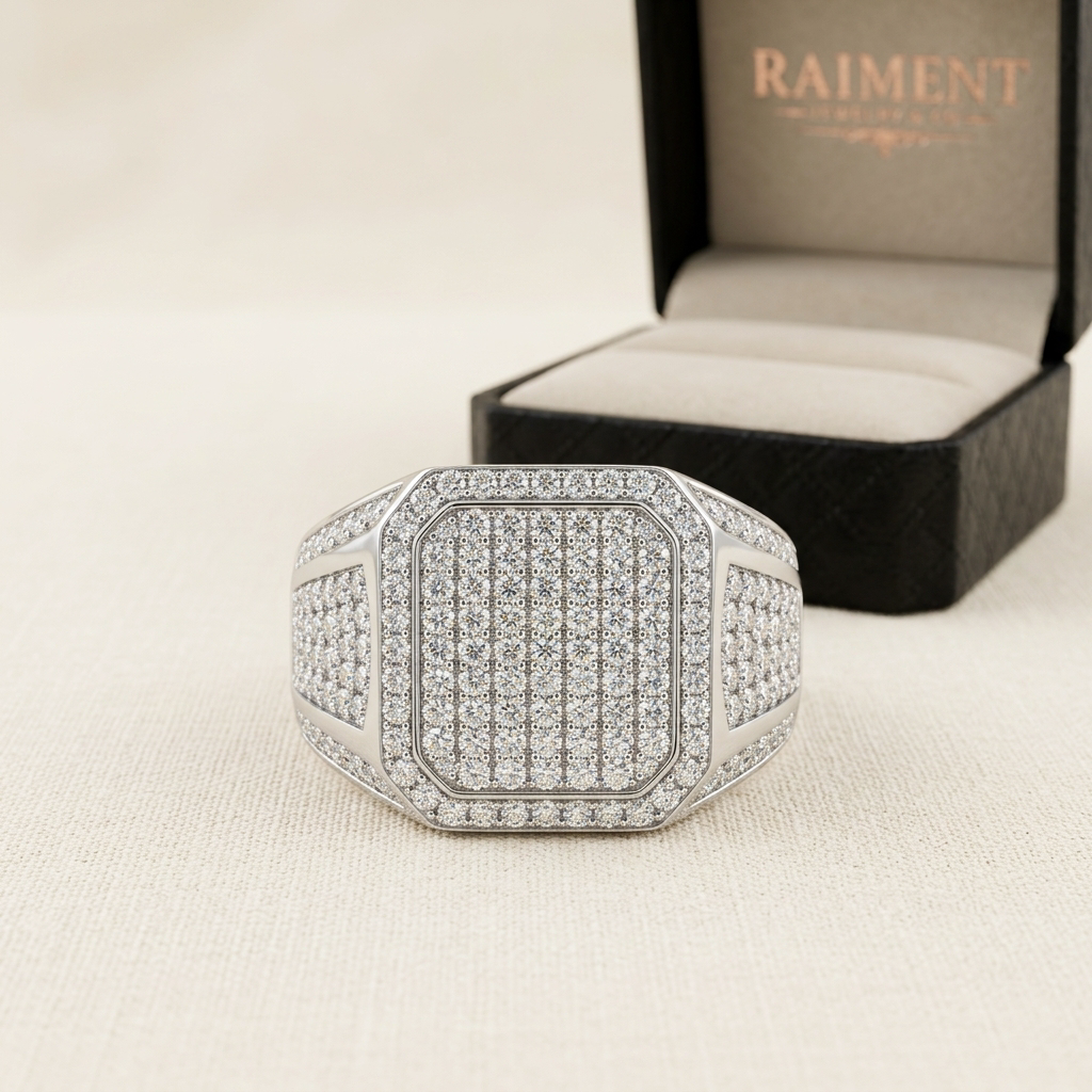 Oval-cut moissanite ring on cream background, Raiment Jewelry & Co.