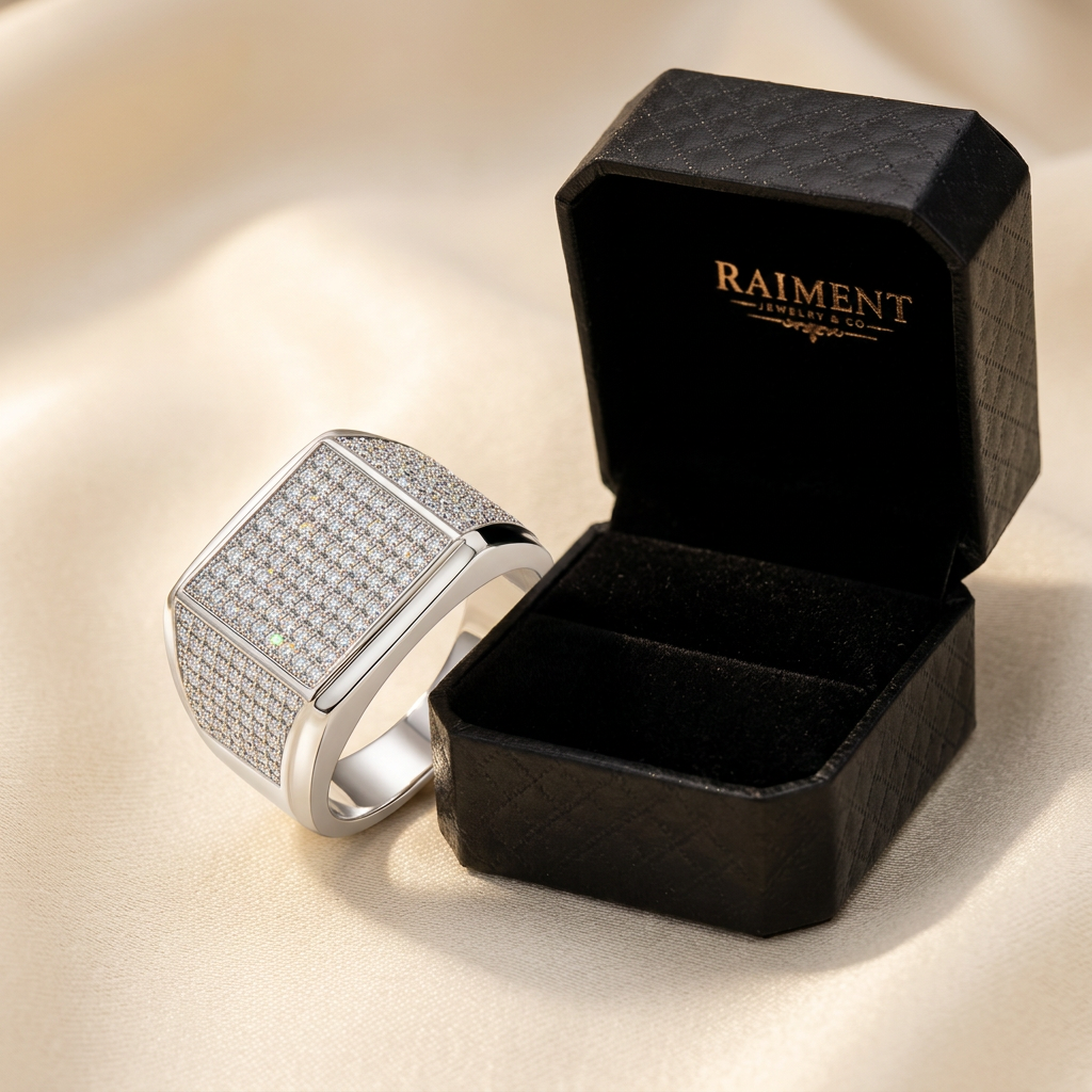 Moissanite accent band ring styled beside jewelry box on cream, Raiment Jewelry & Co.