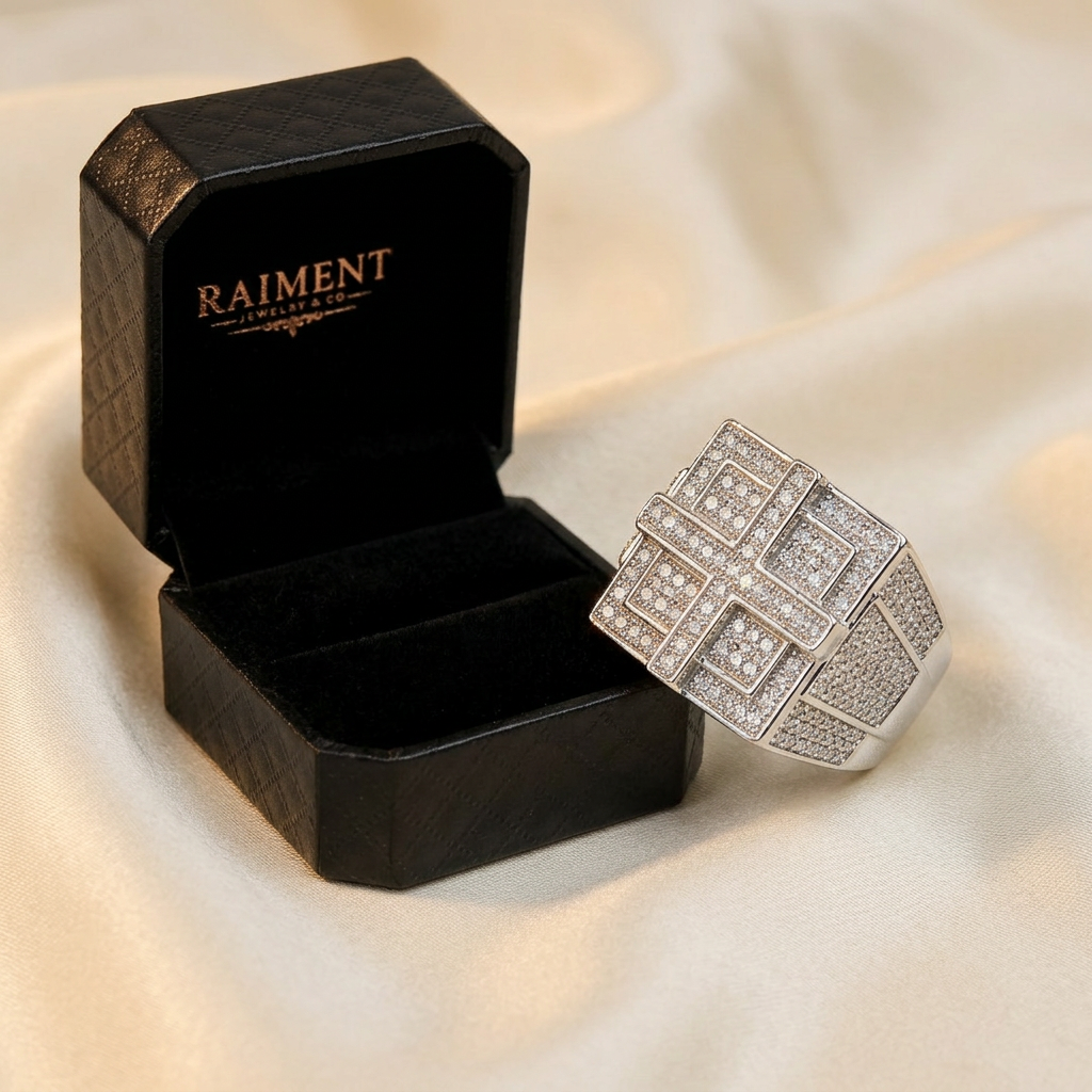 Moissanite whisper-thin band ring styled beside jewelry box on cream, Raiment Jewelry & Co.