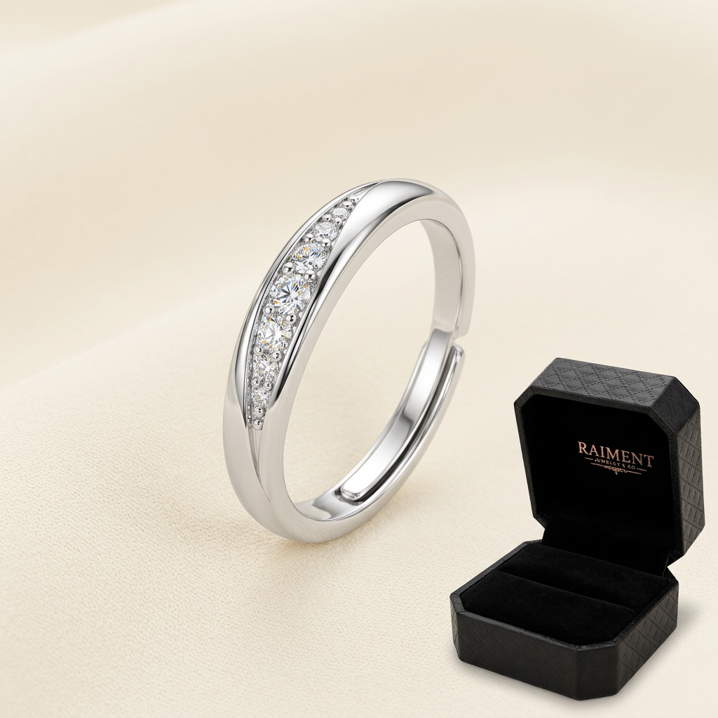 Adjustable moissanite wave ring on cream background, Raiment Jewelry & Co.
