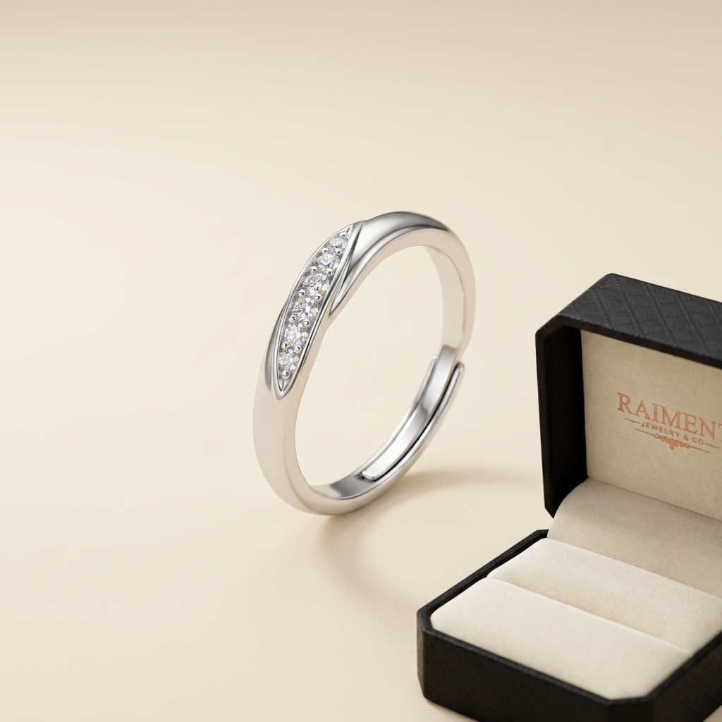 Adjustable moissanite band ring on cream background, Raiment Jewelry & Co.