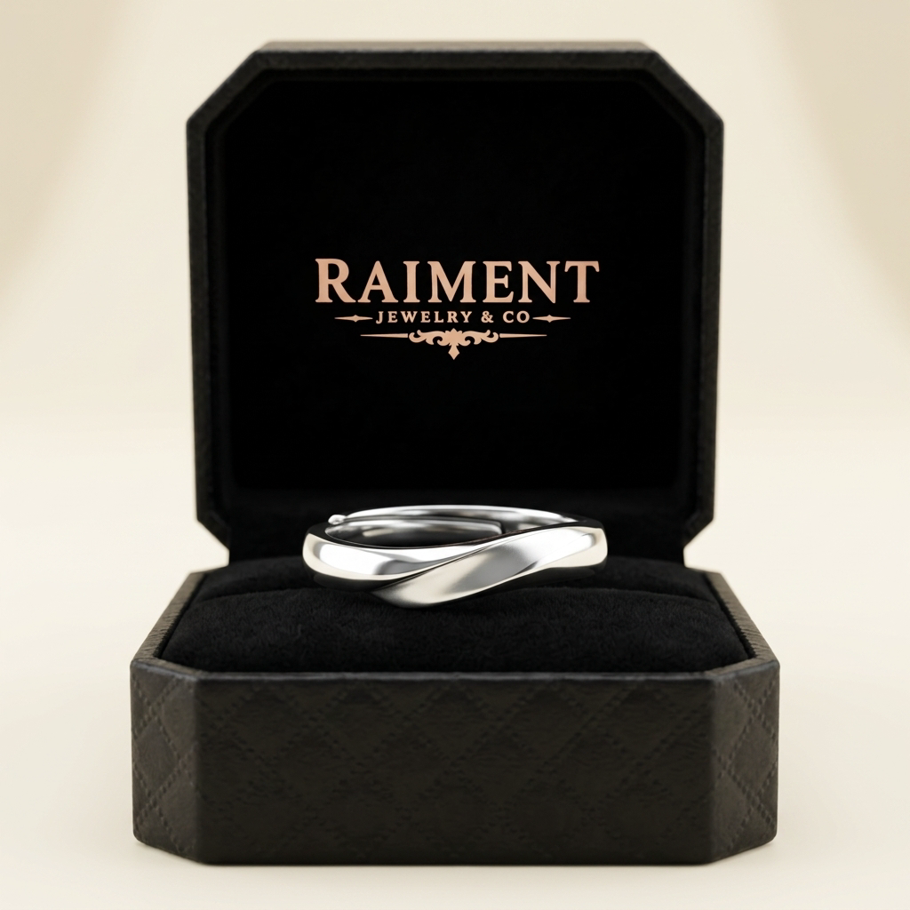 Men's polished band ring inside open jewelry box, Raiment Jewelry & Co.
