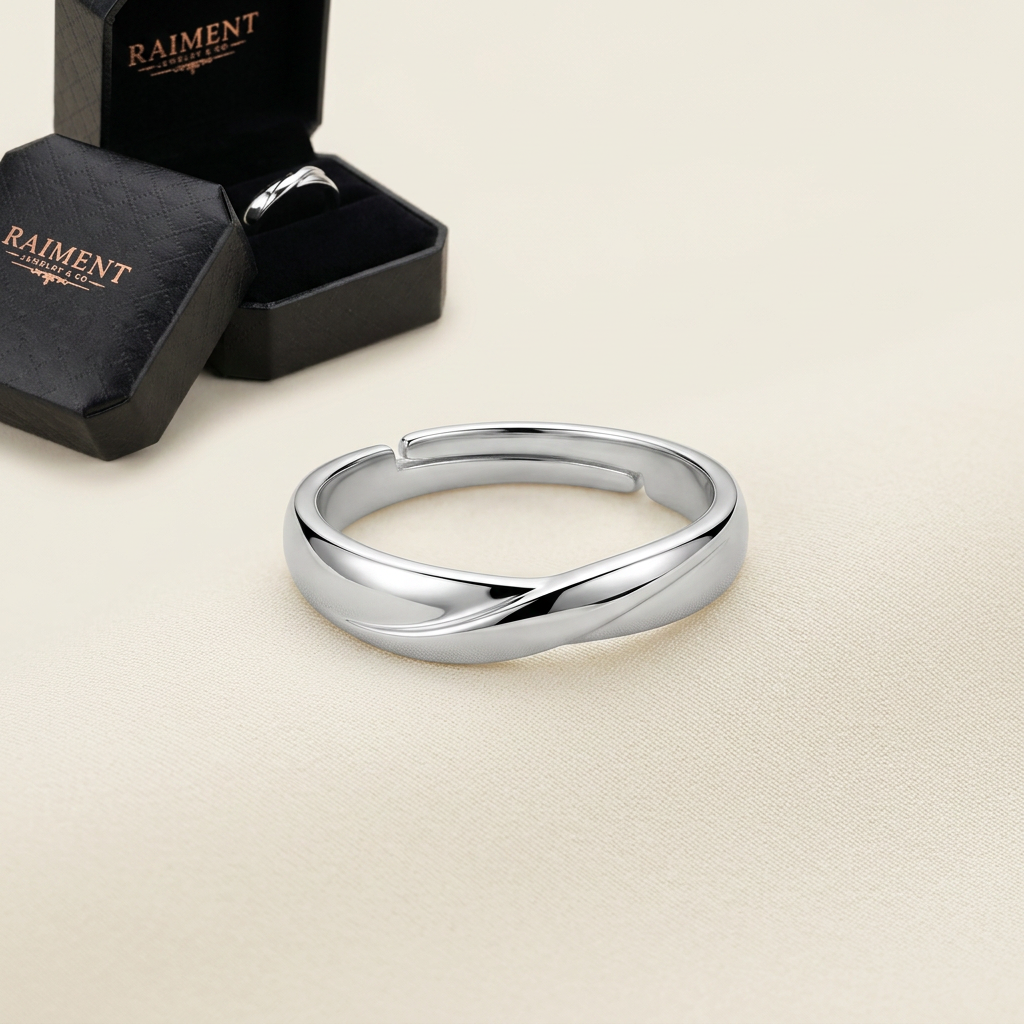 Men's polished band ring on cream background, Raiment Jewelry & Co.