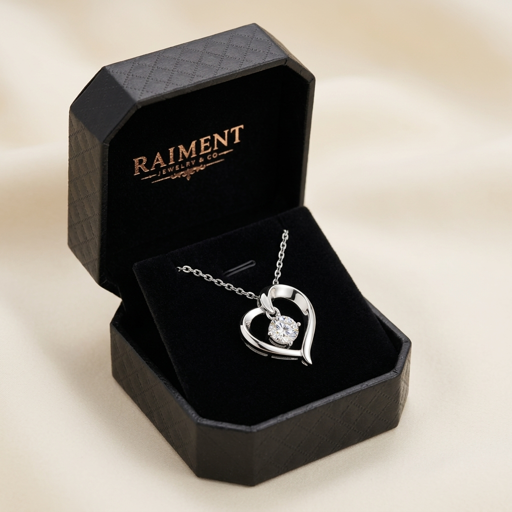 Moissanite infinity love heart pendant inside open jewelry box, Raiment Jewelry & Co.