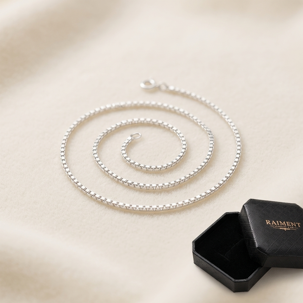 Sterling silver box chain on cream background, Raiment Jewelry & Co.